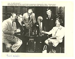 Group of people sitting at a round table