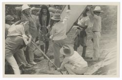 Item 0382. Taken on roof of church. Tissé, far left, head under cloth on camera. Three men at right, holding reflector, man kneeling, right, steadying leg of camera. In front of camera, Eisenstein posing Indigenous penitent with arms tied to cactus stem. See Item 193 above.