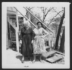 Clara and Marjory Hall standing behind a house in East Gary, Indiana, ca. 1954 (or 1957).