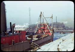 Lake freighter along dock at 92nd St. bridge near mouth of Calumet river. So. Chgo.