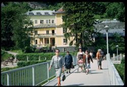 Pedastrians crossing the Salzach on Mullner steg Salzburg X