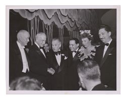 Roy W. Howard with others at a formal event