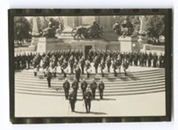 Item 0919. Officers, band, and men of Mexican Army standing on steps of Monument of Independence on the Paseo de la Reforma.