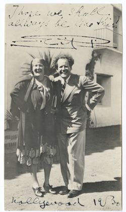Item 0304. Same setting as Item 303 above. Aline Barnsdal and Eisenstein standing together, laughing.