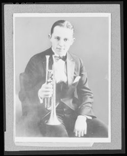 Portrait of Bix Beiderbecke with cornet.