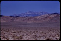 Telescope Peak from highway 11 miles north of Trona, Calif.  Low - lying Slate range in foreground