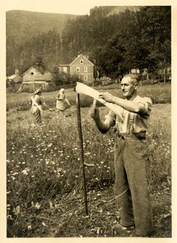 Farmer with sickle near Ohrdruf, Germany