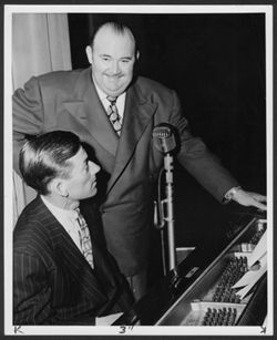 Hoagy Carmichael at the piano with Paul Whiteman, ca. 1940.