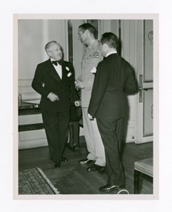 Roy Howard, Mark W. Clark, and Jack Howard at an event
