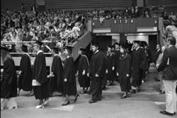 IU South Bend students enter auditorium at Commencement, 1974