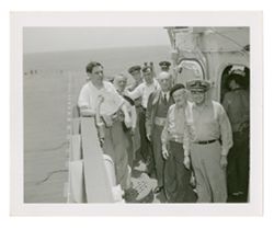 Roy W. Howard and other men on military ship