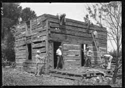 Log cabin sith helpers tearing down same--German place, 1936