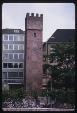 Ancient tower on Rindermarkt amid modern post-war structures Munich