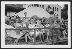 Hoagy Carmichael standing amongst crowd at a tennis match at the Riviera Country Club.