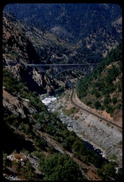 Hwy arch bridge crosses above W.P.RR and North Fork Feather River near Pulga. Butte county, Calif.