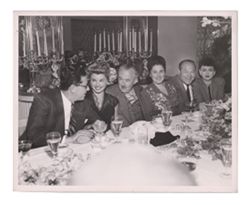 Roy W. Howard with Lois Moran and others at a formal dinner