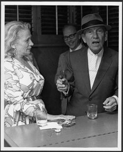 Hoagy Carmichael talking with Helene Bowman, with Bob Stoll (Director of Singing Hoosiers) in the background, Hollywood.