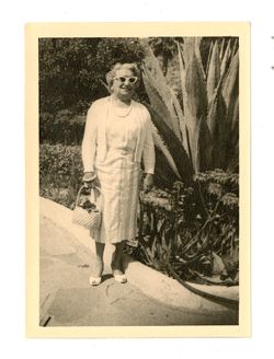 Margaret Howard in front of a garden