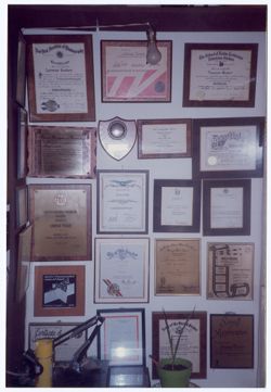 Wall with award plaques presented to Lorenzo Tucker