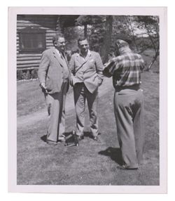 Roy W. Howard and others at cab in