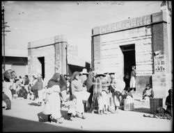 General view of figures on move at Oaxaca Market, horiz