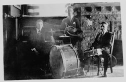 Two pictures: a) Hoagy Carmichael with "My first band, 1919 - taken at Kappa Sigma House. Horn - Ted Cadou, Drums - Beshenbeizer." b) Ruth, Howard, and Hoagy Carmichael in New York, 1939.