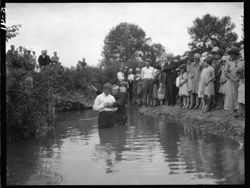 Standing in water, at baptizing