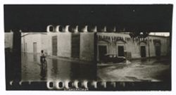 Item 0338a. Three strips of contact prints showing various scenes in flooded city streets. 2 ¼ prints on a strip.