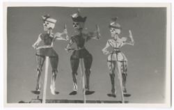 Item 32. Three jointed skeleton puppets on sticks.