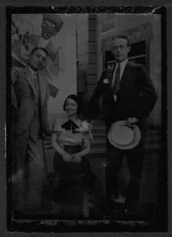 Souvenir of Hoagy Carmichael with unidentified man and woman at Chicago World's Fair, "Streets of Paris" exhibit.