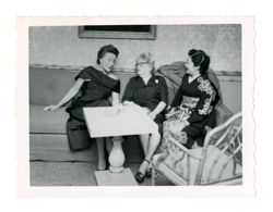 Margaret Howard sitting between two other women