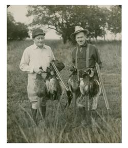 Roy W. Howard and friend hunting birds