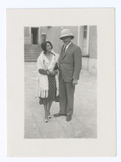 Item 1148. Unidentified woman, left, and Hunter Kimbrough, right, standing in Hacienda courtyard.