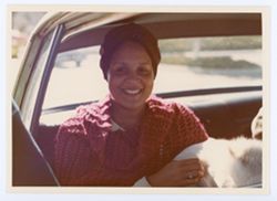 Unidentified woman in automobile during Black History Month Celebration