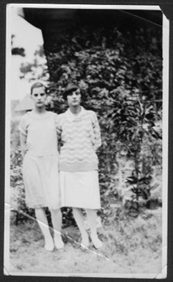 Martha and Georgia Carmichael posing in a yard.