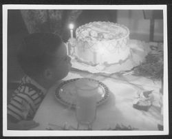 Hoagy Bix Carmichael blowing out birthday candles.
