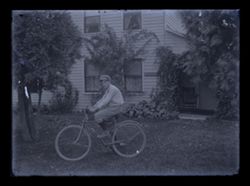 Glass negatives of bicycling scenes