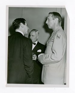 Mark W. Clark talking with other men