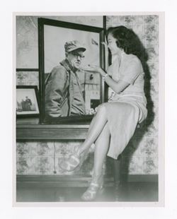 Woman posing with photo of Roy Howard