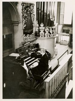 Organ player at organ inside St. Augustine Church in Gotha Germany