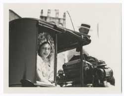 Item 0073a. Closer shot of young woman in white in Item 73 above looking out of coach window. Driver is seated in box. Taken from slightly behind the coach.